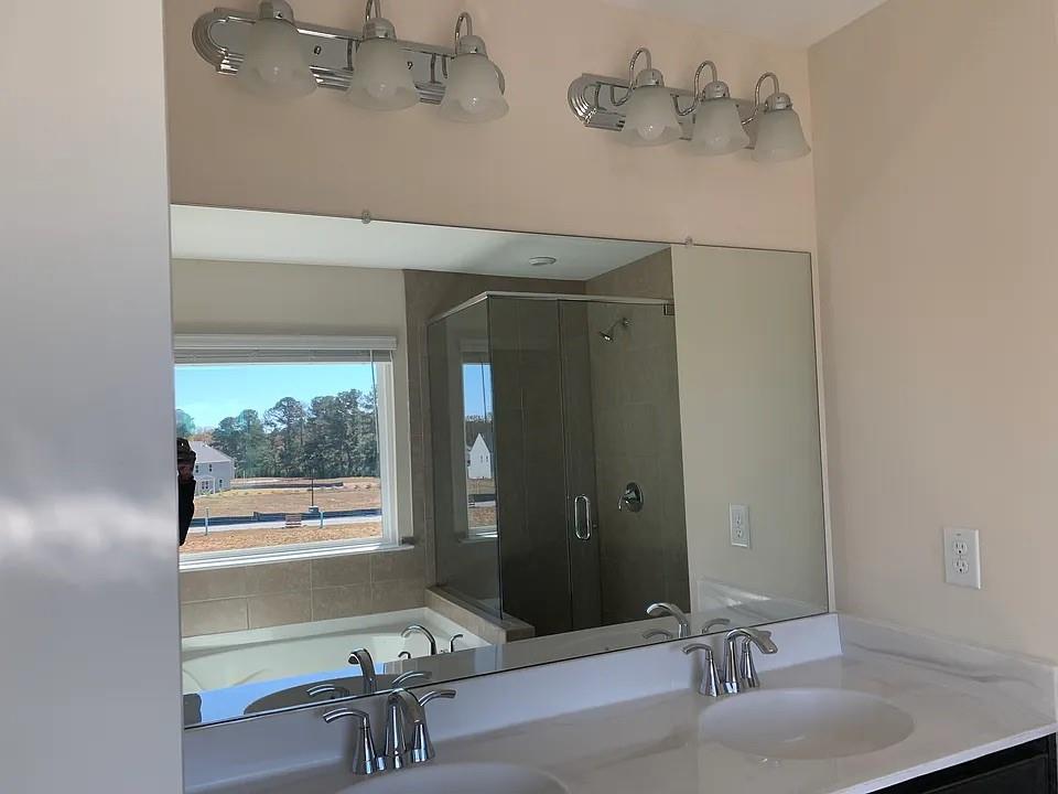 2770 Port Bow Lane Cumming, GA 30041 - Photo 15 of 20 a bathroom with a sink and a mirror