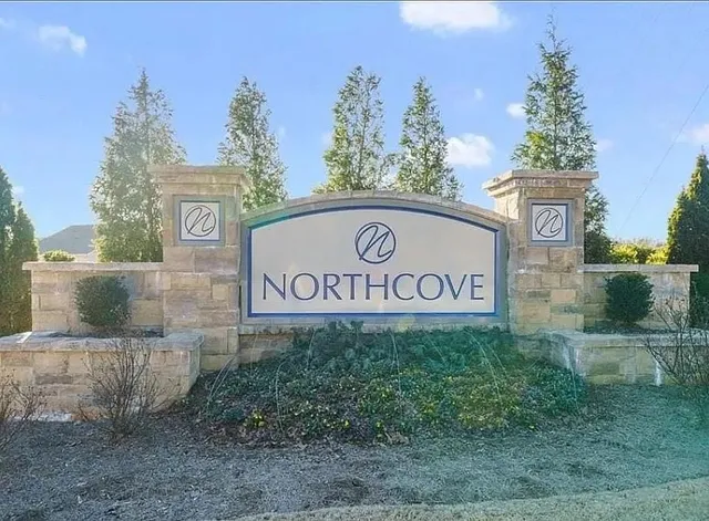 a sign broad in front of the house