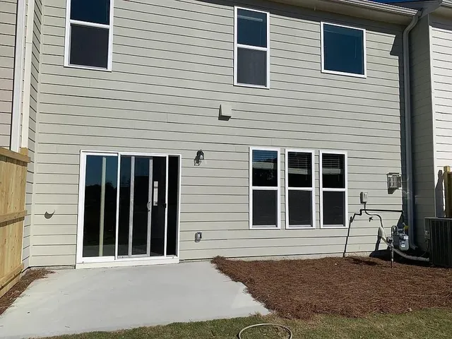 a view of a brick house with a window