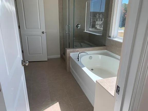 2770 Port Bow Lane Cumming, GA 30041 - Photo 5 of 20 a bathroom with a bathtub and shower