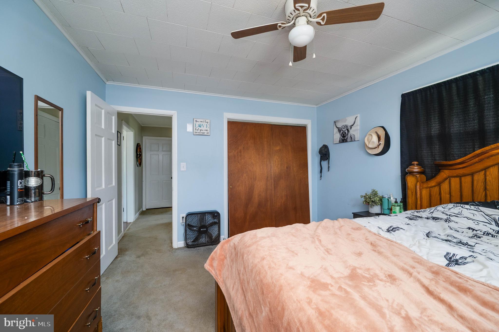 1144 Brownsville Road Wernersville, PA 19565 - Photo 16 of 24 a bedroom with a bed and a chandelier