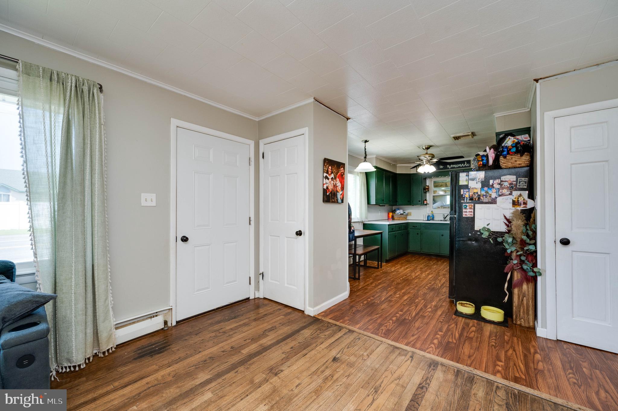 1144 Brownsville Road Wernersville, PA 19565 - Photo 10 of 24 a view of a livingroom with wooden floor and a ceiling fan