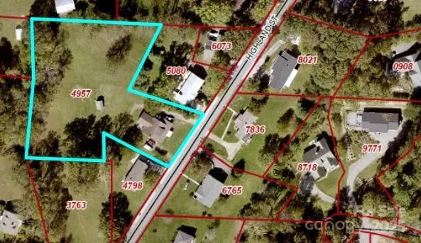 a aerial view of a house with a yard