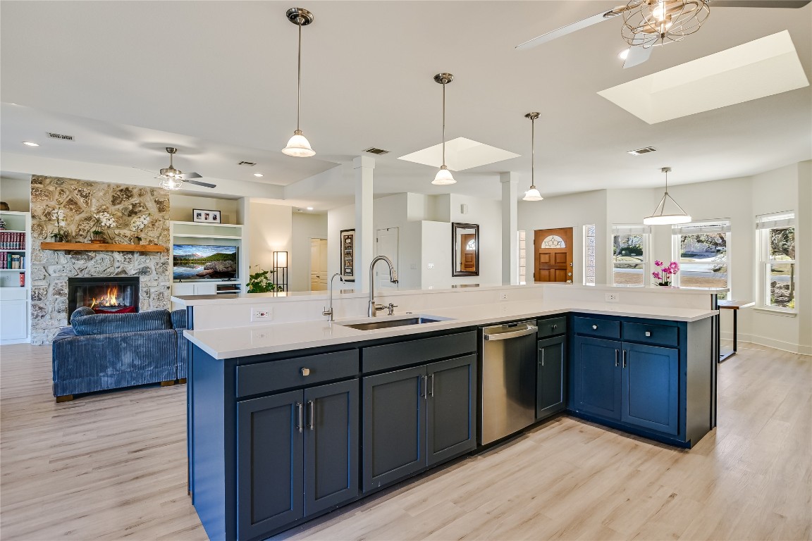 945 Wesley Ridge Drive Spicewood, TX 78669 - Photo 12 of 40 View from the kitchen into the living area highlights the connection between spaces, keeping everyday living and entertaining comfortably linked.
