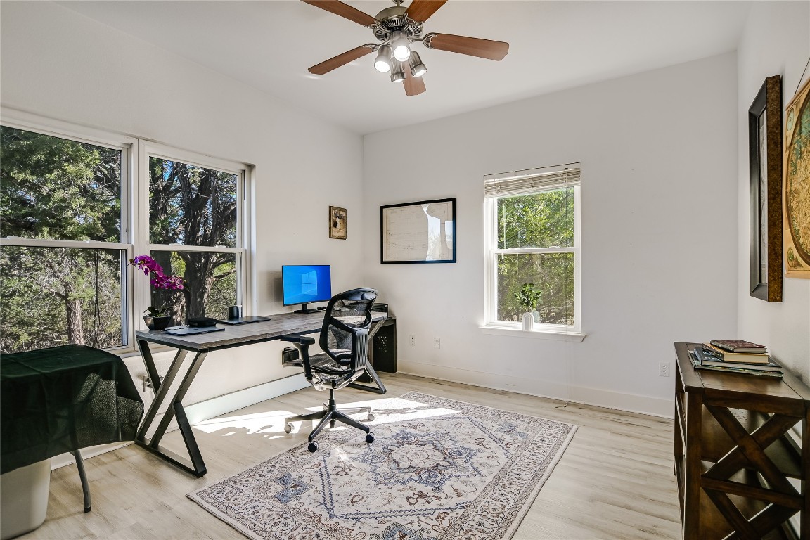 945 Wesley Ridge Drive Spicewood, TX 78669 - Photo 17 of 40 Flexible study or fifth bedroom has direct access to the back porch.
