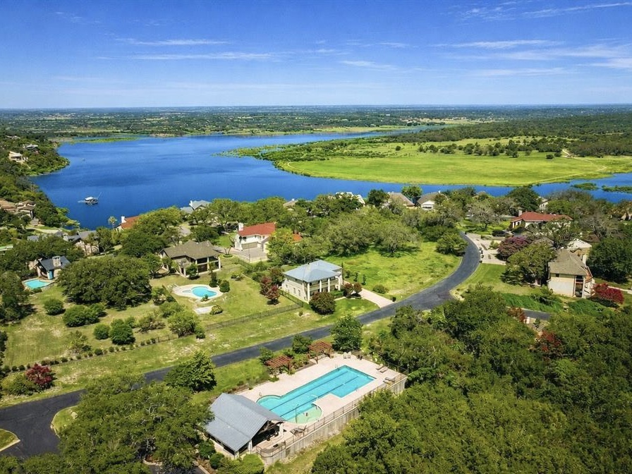 945 Wesley Ridge Drive Spicewood, TX 78669 - Photo 33 of 40 Community Amenities include a resort-style pool, tennis and pickleball courts, two private boat launches, a small play area for the children, and a waterfront park with grills and seating areas. All amenities are private for the use of Ridge Harbor property owners and their guests.