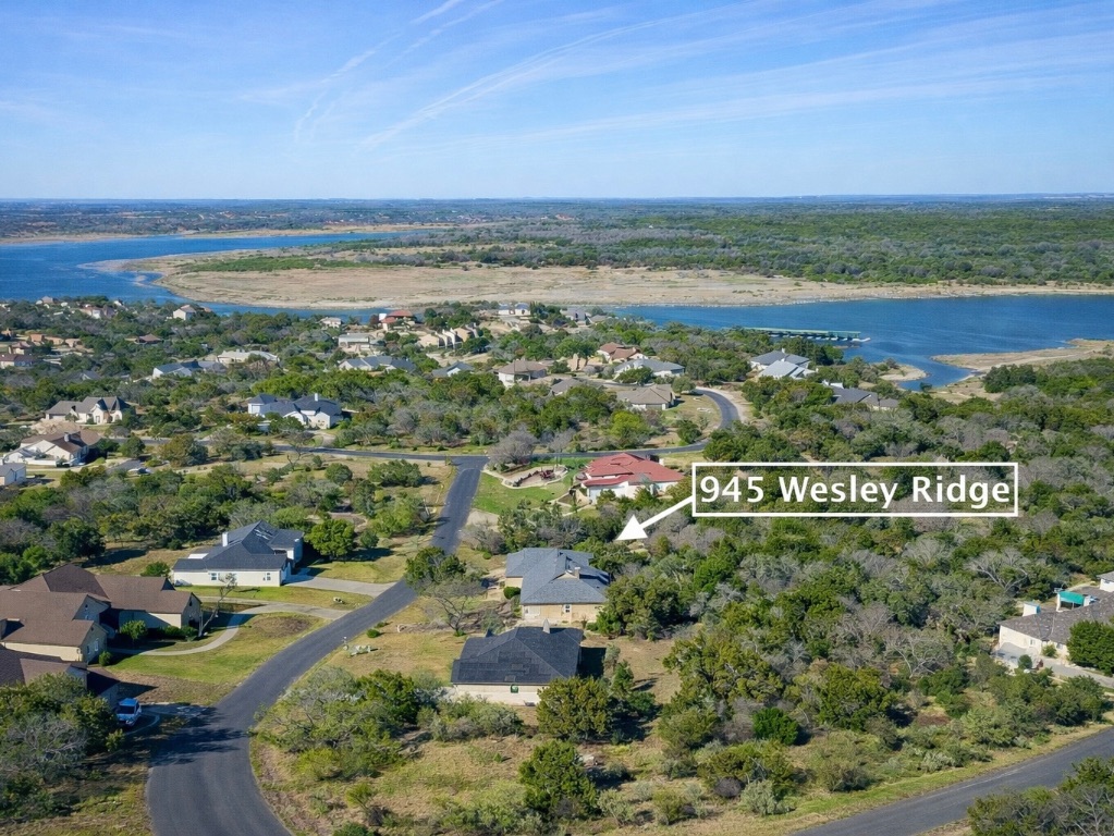 945 Wesley Ridge Drive Spicewood, TX 78669 - Photo 4 of 40 Bird’s-eye view of the Ridge Harbor community and Lake Travis shoreline. Lake access and waterfront amenities within the community are easily accessible to property owners.