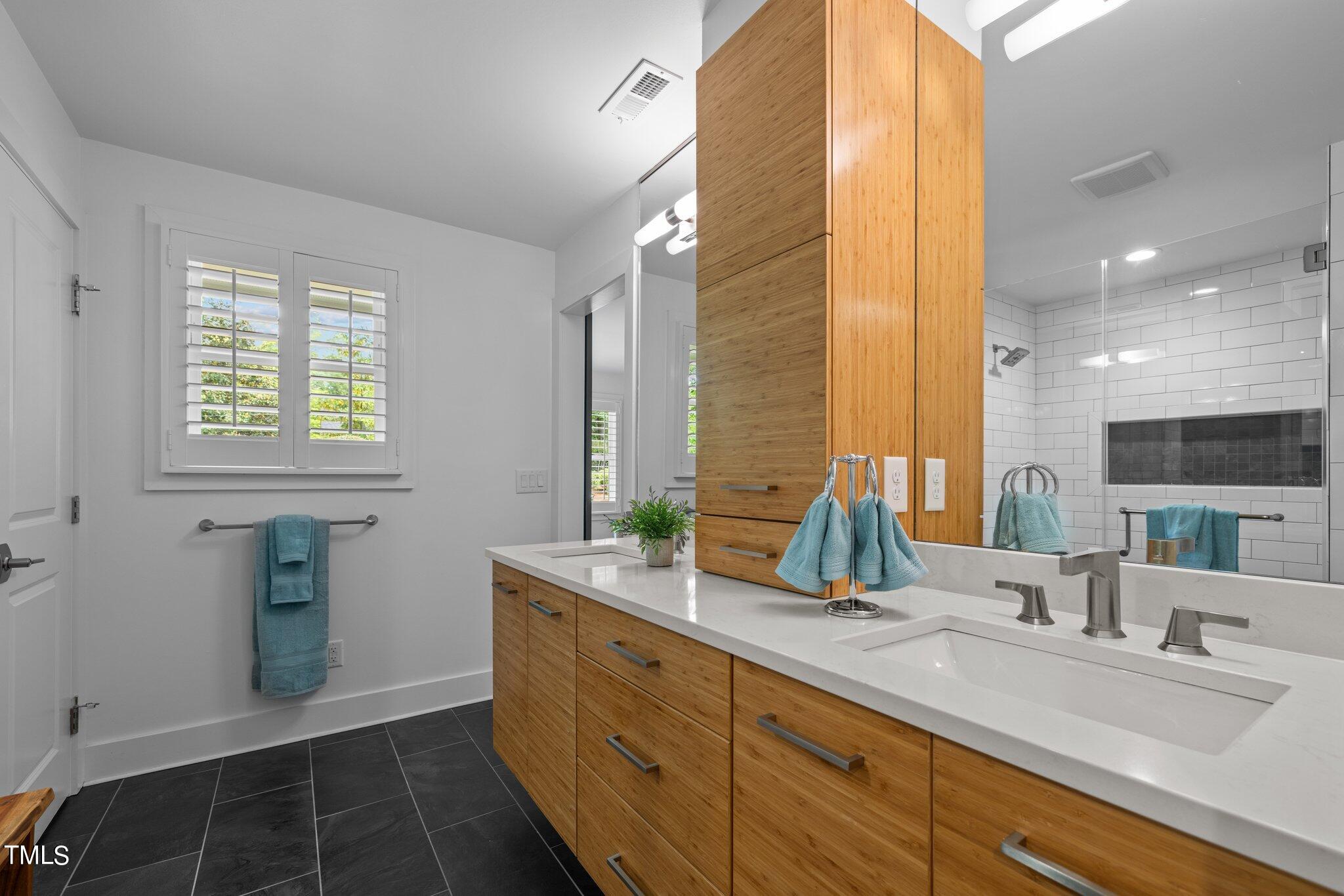 1110 Dogwood Lane Raleigh, NC 27607 - Photo 13 of 46 Quartz countertops with floating double vanity