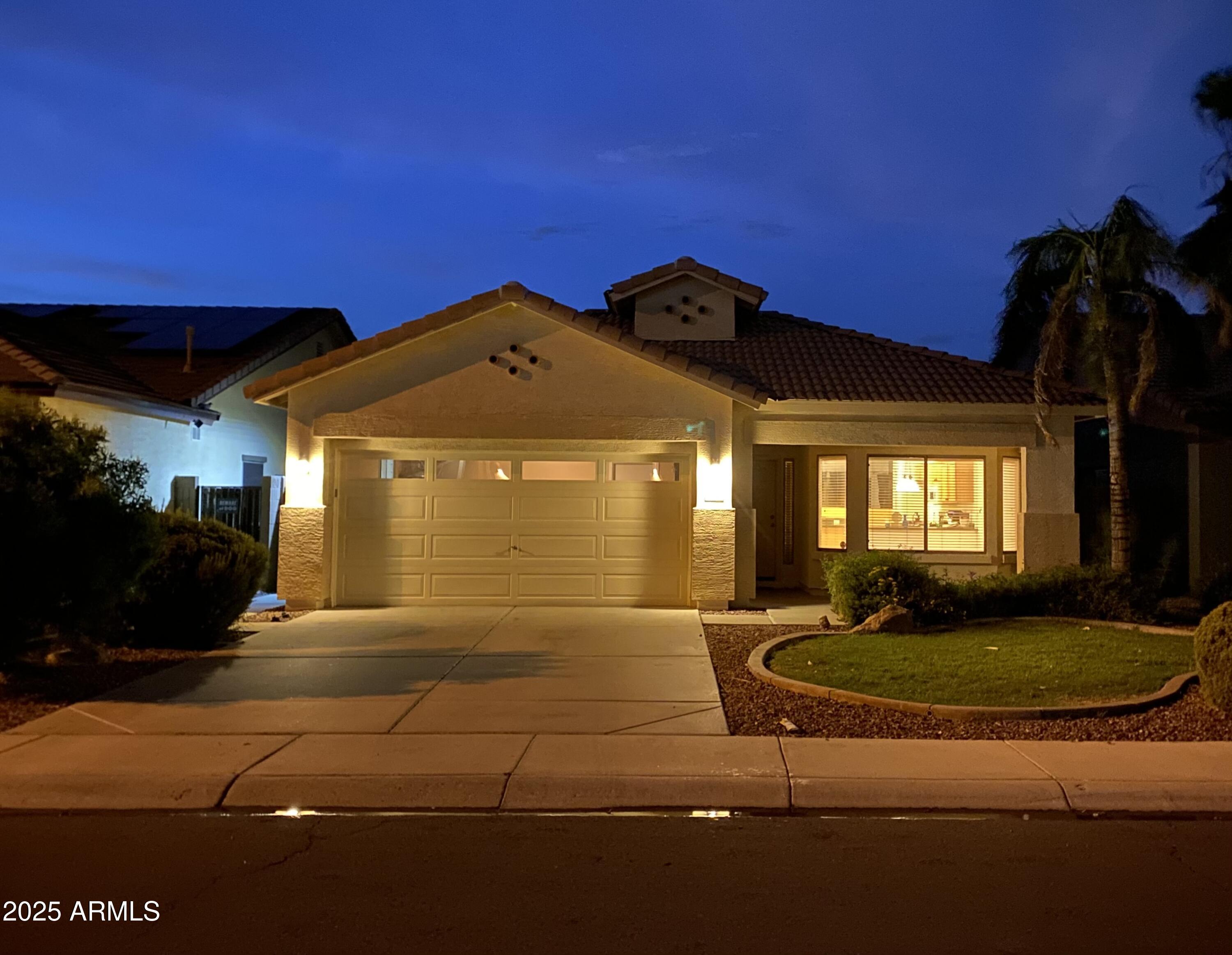 12542 West Honeysuckle Street Litchfield Park, AZ 85340 - Photo 1 of 19 a view of a house with a small yard