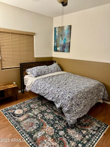 a bedroom with bed and window