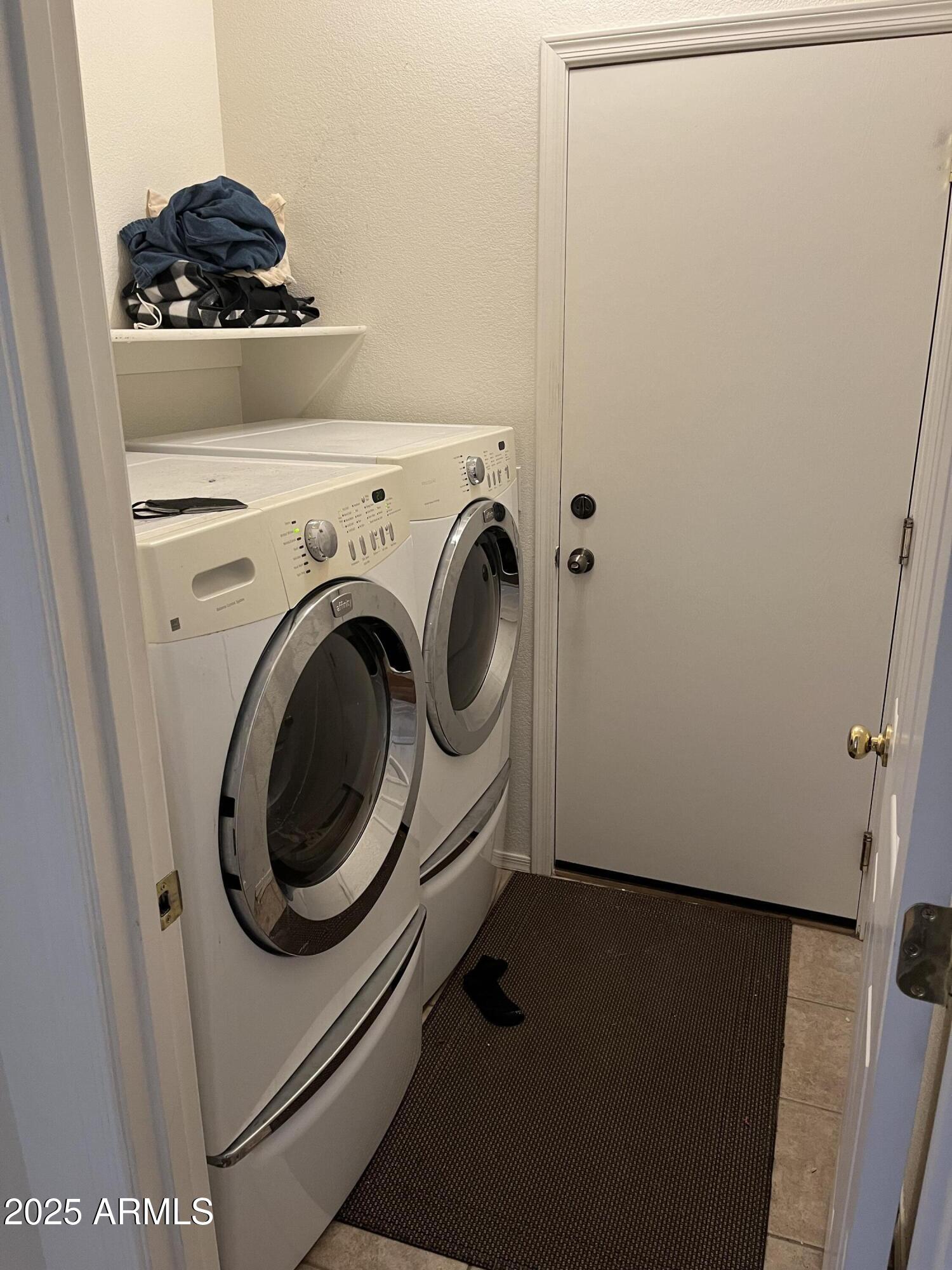 12542 West Honeysuckle Street Litchfield Park, AZ 85340 - Photo 12 of 19 a utility room with dryer and washer
