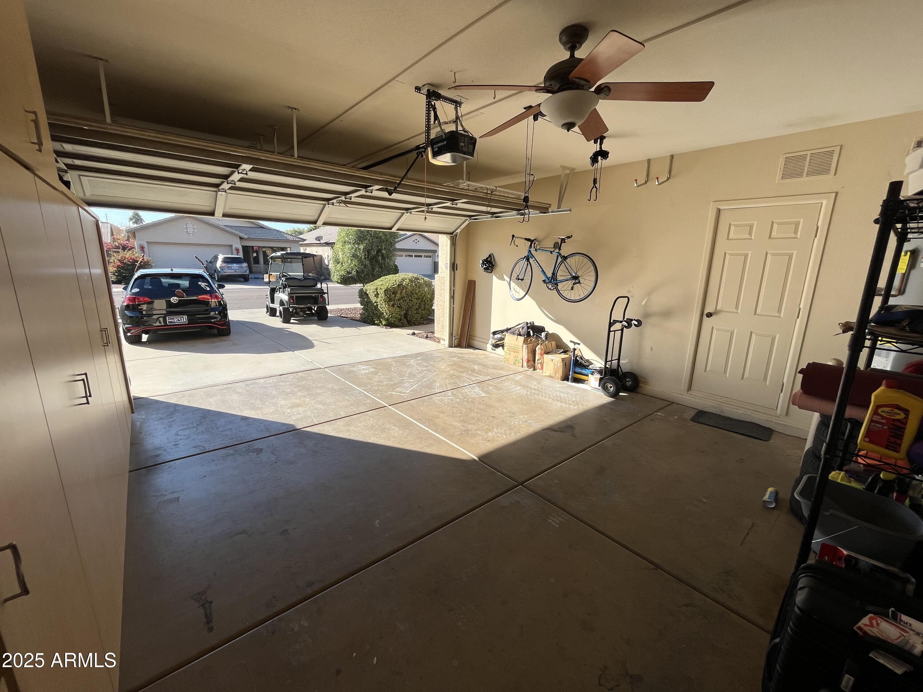 12542 West Honeysuckle Street Litchfield Park, AZ 85340 - Photo 16 of 19 a view of parking garage with cars