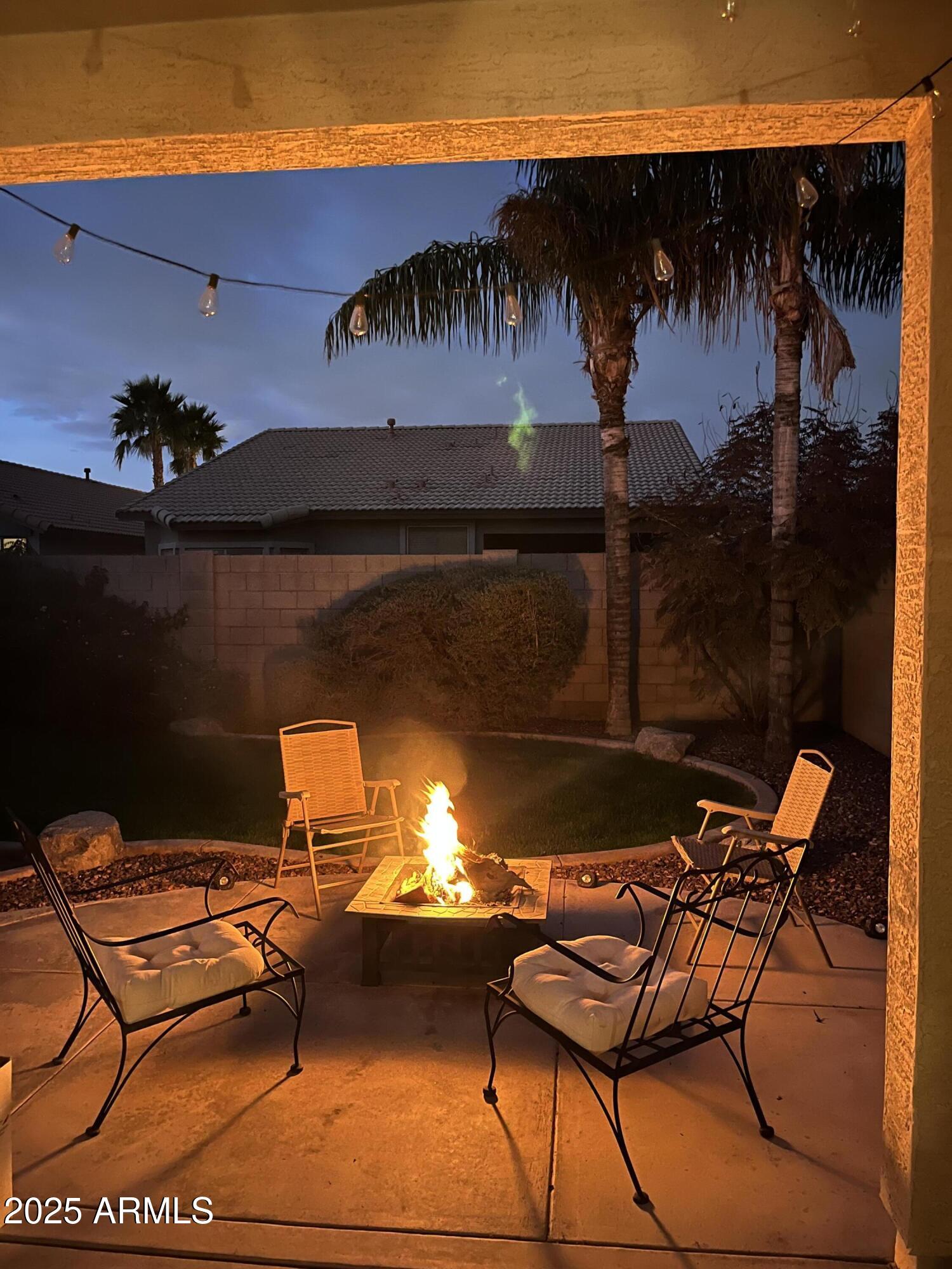 12542 West Honeysuckle Street Litchfield Park, AZ 85340 - Photo 19 of 19 a view of a chairs and table in patio