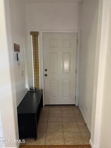 a view of a closet area with living room