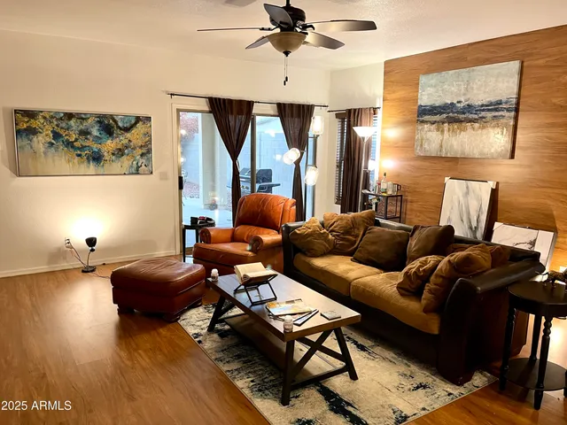 a living room with furniture and a window