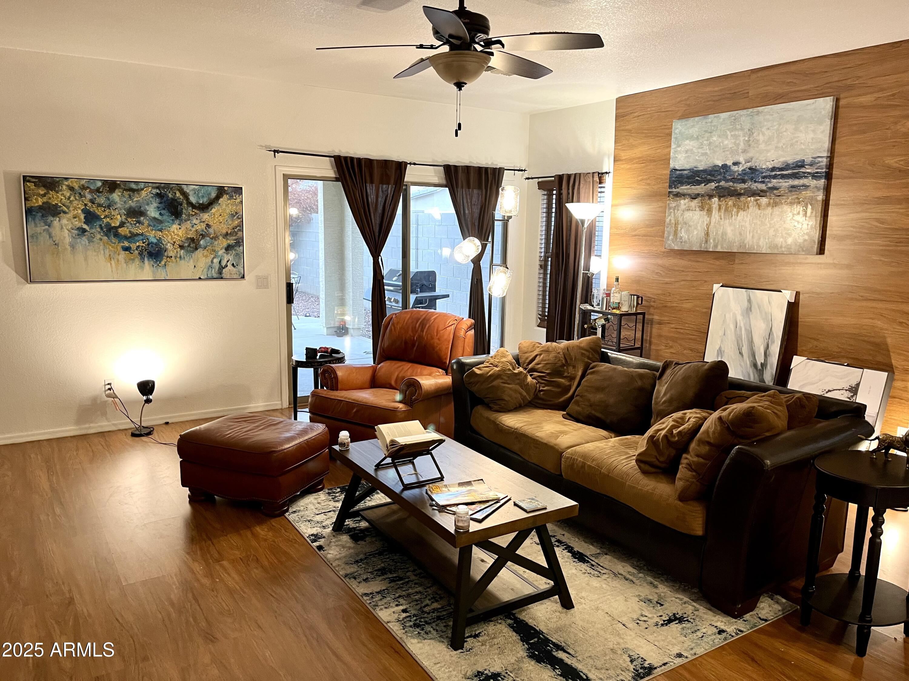 12542 West Honeysuckle Street Litchfield Park, AZ 85340 - Photo 3 of 19 a living room with furniture and a window