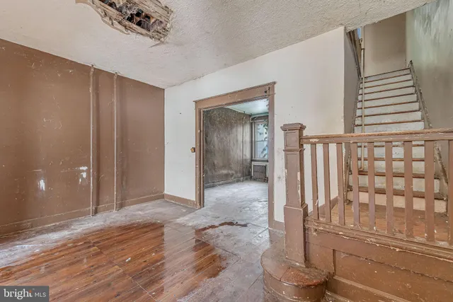a view of entryway with wooden floor