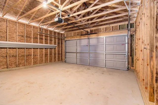 a view of an empty room with a staircase