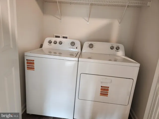 a bathroom with a toilet and a bath tub