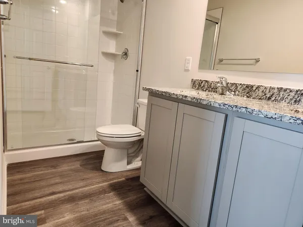 a bathroom with a toilet and a sink