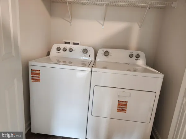 a bathroom with a toilet and a bath tub