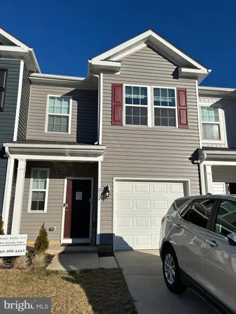a view of a car parked in front of a house