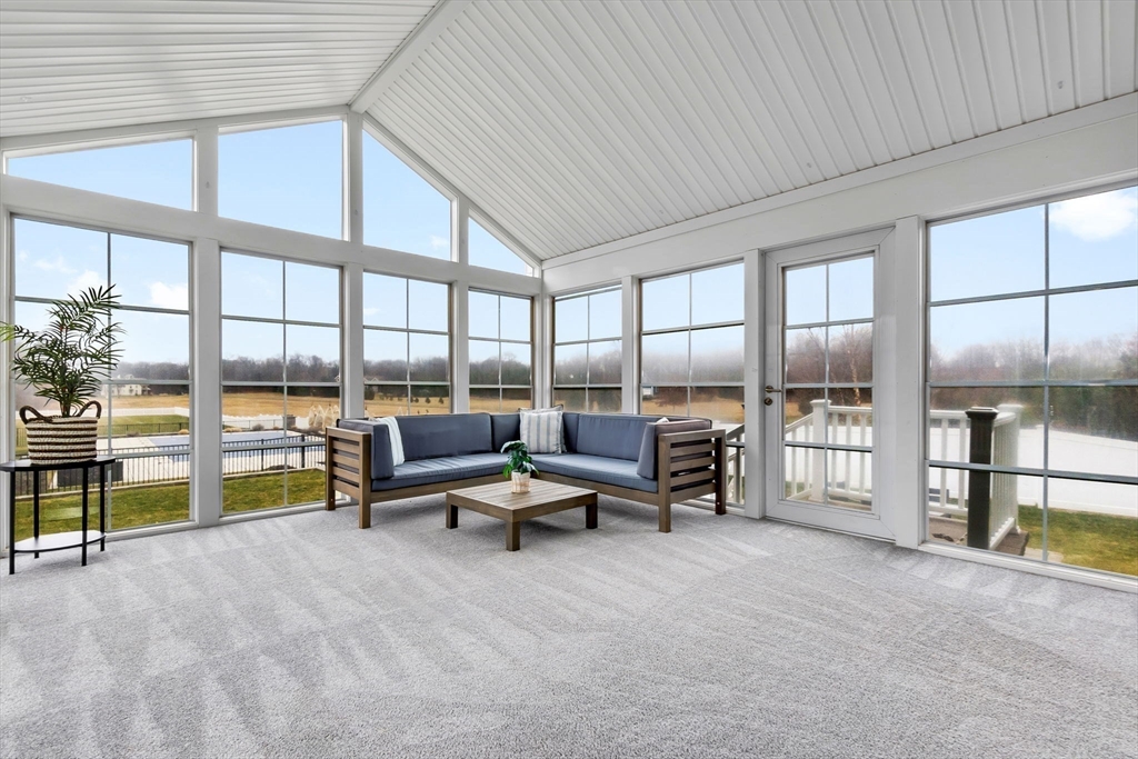 253 High Road Newbury, MA 01951 - Photo 12 of 42 a living room with furniture and a floor to ceiling window