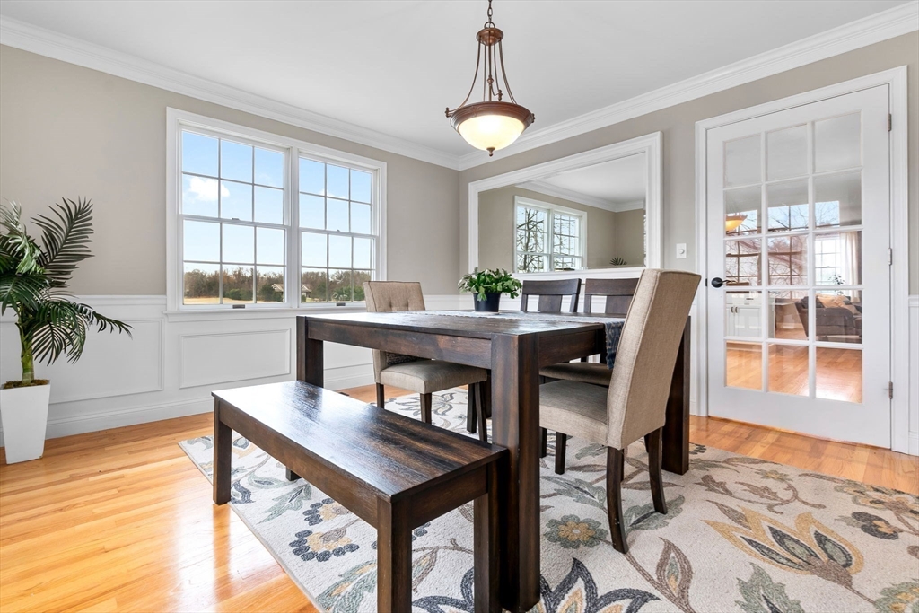 253 High Road Newbury, MA 01951 - Photo 14 of 42 a view of a dining room with furniture and wooden floor