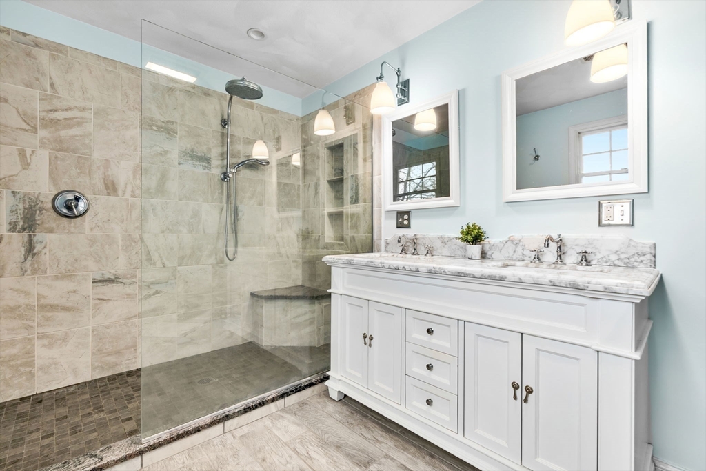 253 High Road Newbury, MA 01951 - Photo 23 of 42 a bathroom with a granite countertop sink mirror and shower