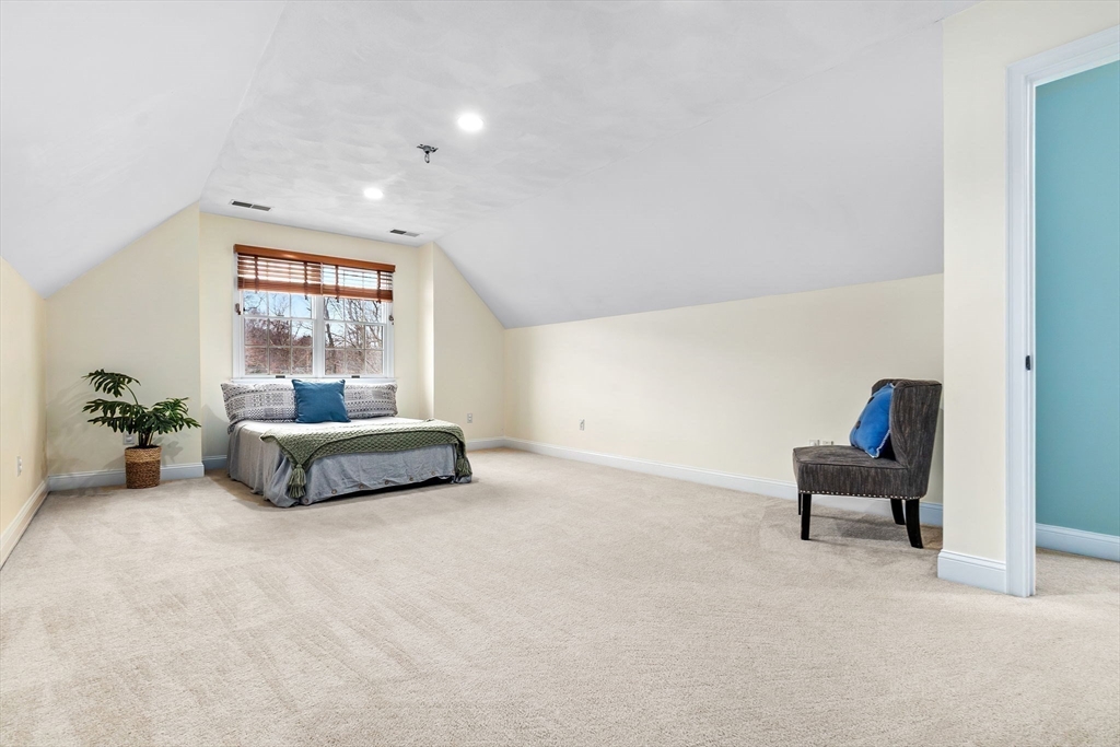 253 High Road Newbury, MA 01951 - Photo 26 of 42 a living room with furniture and a chandelier