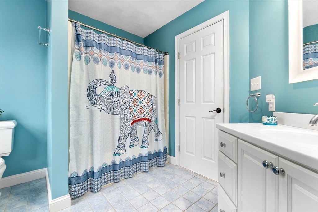 253 High Road Newbury, MA 01951 - Photo 31 of 42 a bathroom with a sink and a mirror