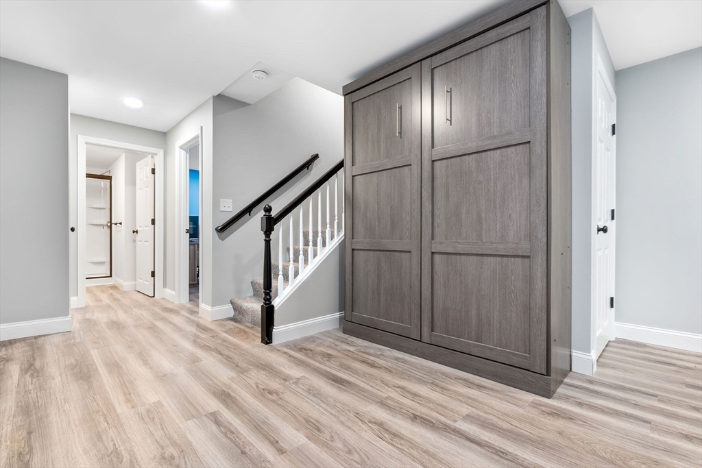 253 High Road Newbury, MA 01951 - Photo 32 of 42 a view of a hallway with wooden floor and staircase