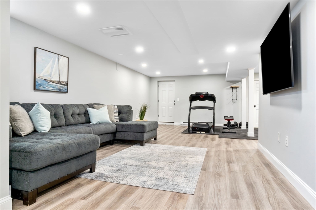253 High Road Newbury, MA 01951 - Photo 34 of 42 a living room with furniture and flat screen tv