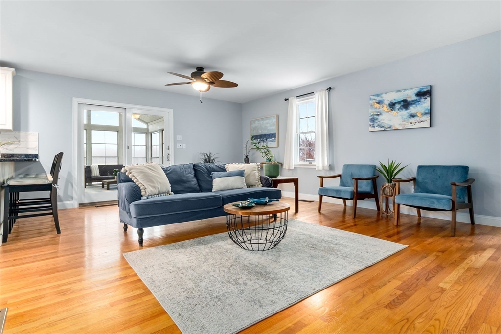 253 High Road Newbury, MA 01951 - Photo 9 of 42 a living room with patio furniture and a wooden floor