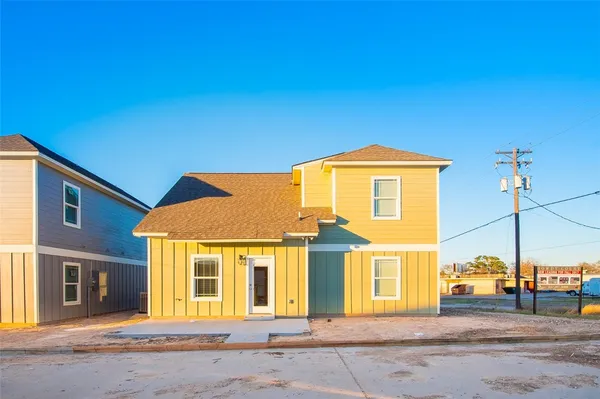 a front view of a house with a outdoor space
