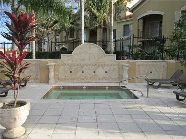 a white bench sitting in front of a house