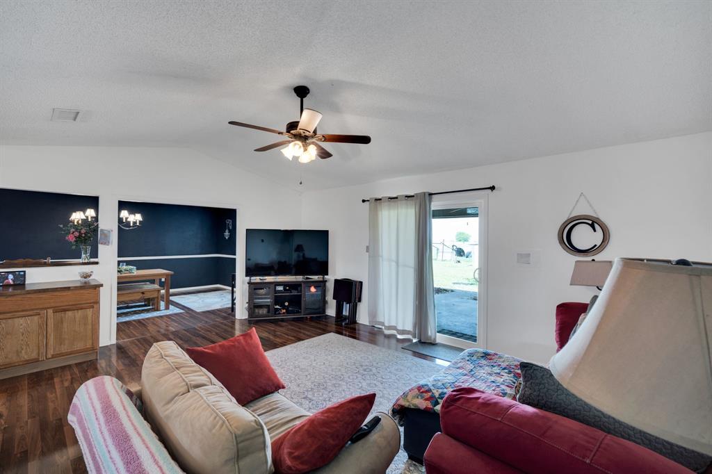 430 Carter Road Italy, TX 76651 - Photo 20 of 36 a living room with furniture a flat screen tv and kitchen view
