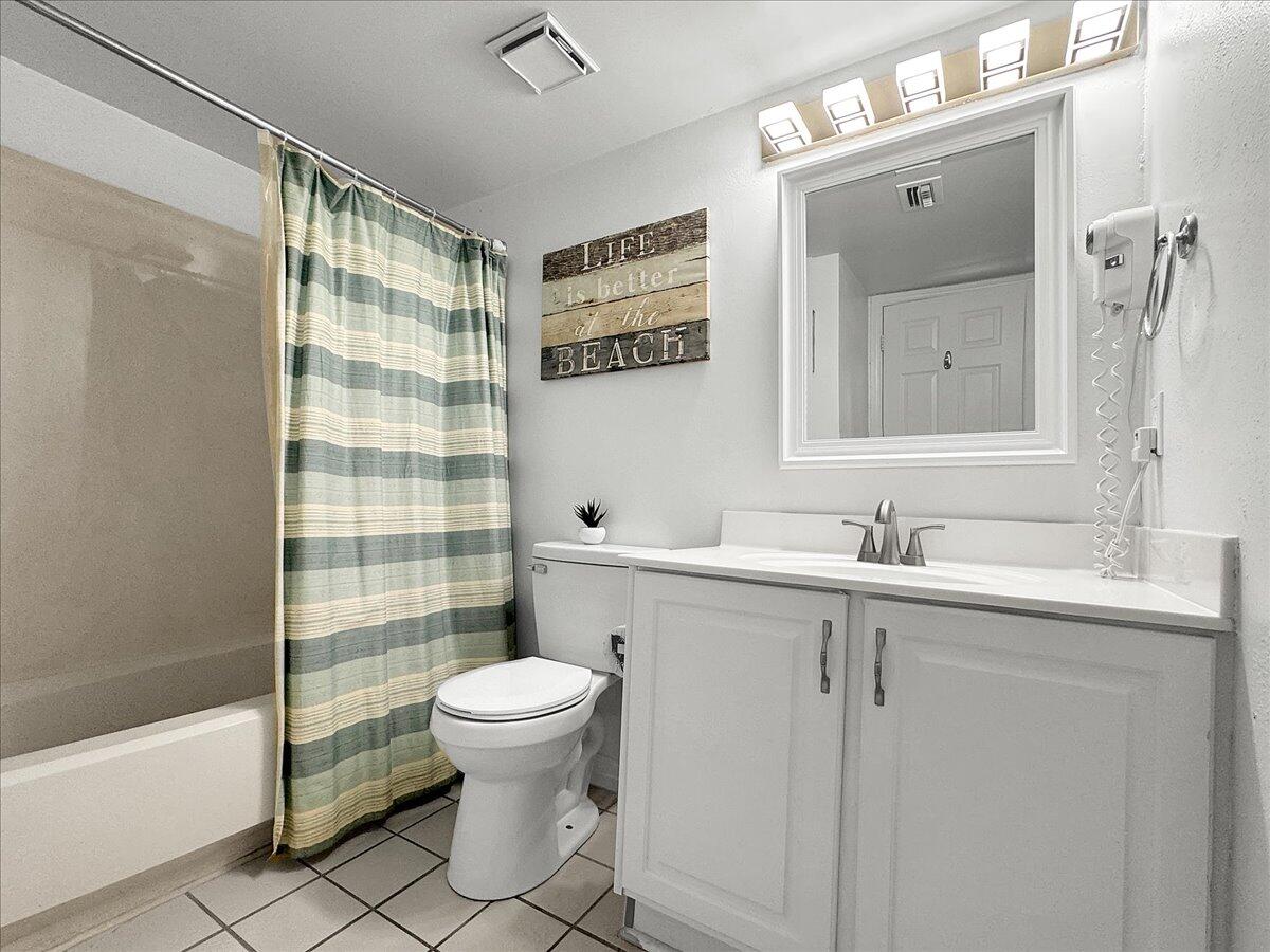 1002 Highway 98, Unit 316 Destin, FL 32541 - Photo 14 of 31 a bathroom with a sink toilet and shower