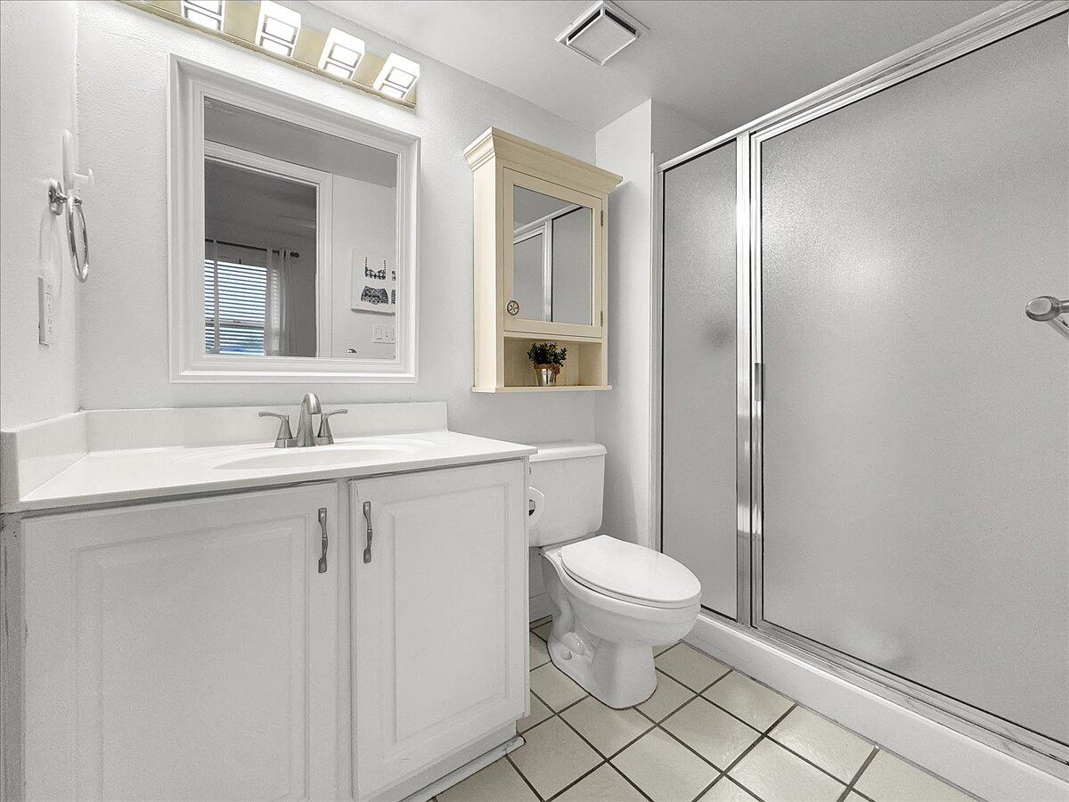 1002 Highway 98, Unit 316 Destin, FL 32541 - Photo 16 of 31 a bathroom with a sink toilet and shower