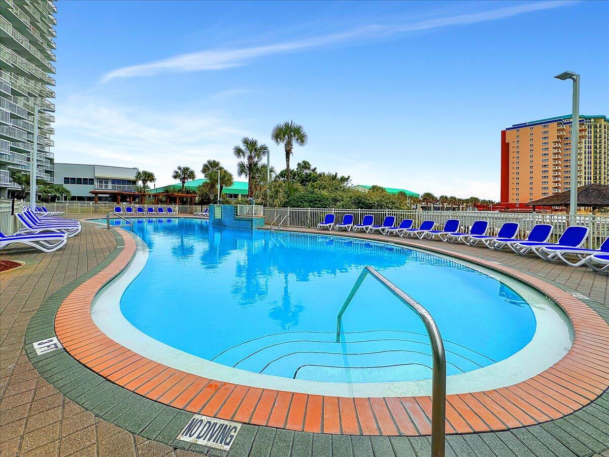 1002 Highway 98, Unit 316 Destin, FL 32541 - Photo 19 of 31 a swimming pool with outdoor seating yard and barbeque oven