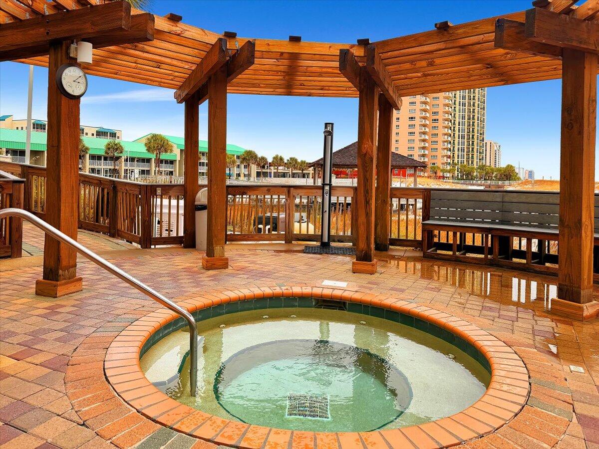 1002 Highway 98, Unit 316 Destin, FL 32541 - Photo 20 of 31 a view of a swimming pool with a lounge chairs