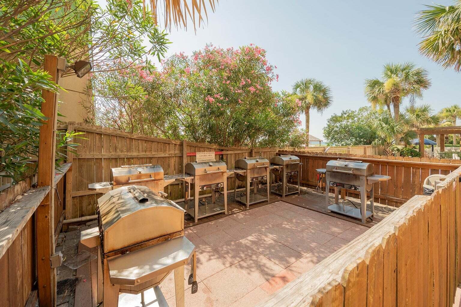 1002 Highway 98, Unit 316 Destin, FL 32541 - Photo 25 of 31 a view of a deck with two chair and tables