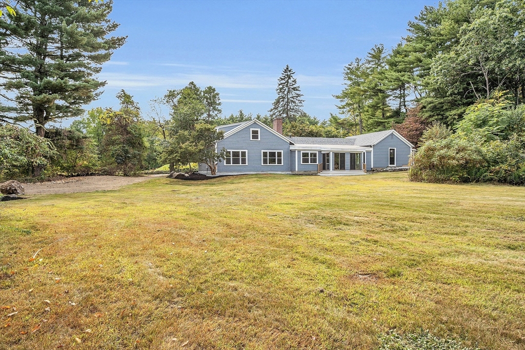 43 Brown Road Harvard, MA 01451 - Photo 21 of 23 a view of an ocean with a house in the background
