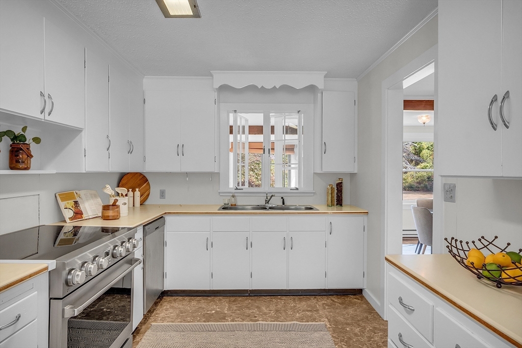 43 Brown Road Harvard, MA 01451 - Photo 4 of 23 a kitchen with stainless steel appliances granite countertop a sink stove and cabinets