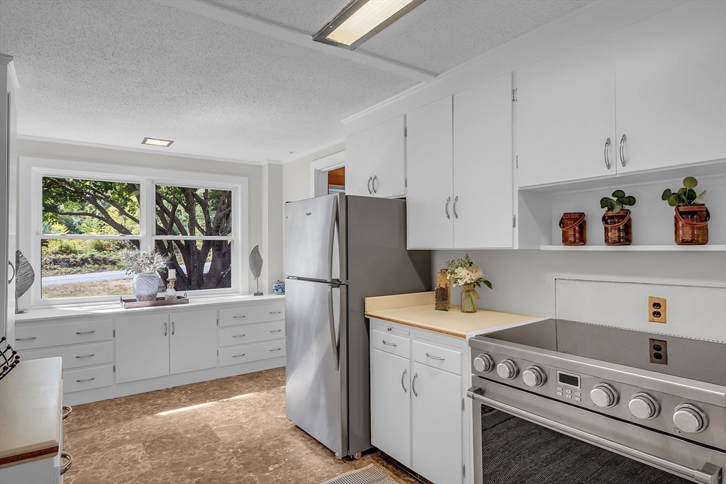 43 Brown Road Harvard, MA 01451 - Photo 6 of 23 a kitchen with a stove a refrigerator and a sink
