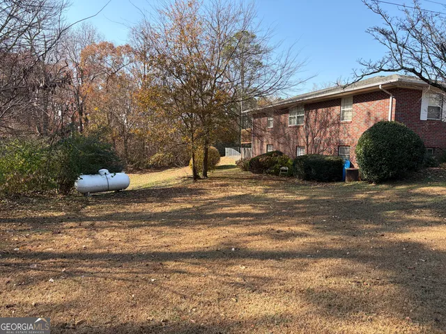 a backyard of a house with lots of green space