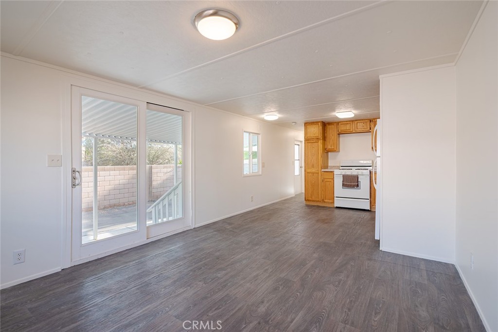 73 Alesandro Road, Unit A Palm Springs, CA 92264 - Photo 11 of 23 wooden floor in an empty room with a window