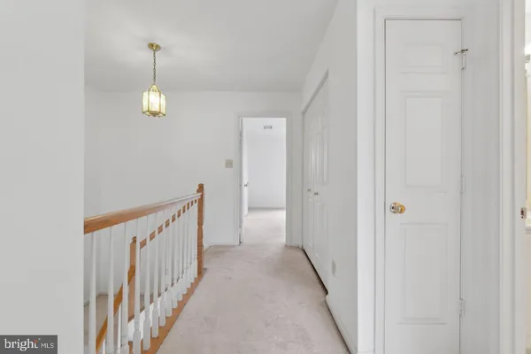 a view of a hallway view with staircase