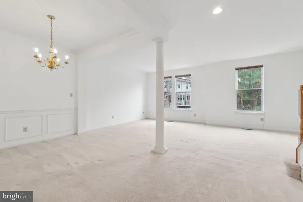 a view of empty room with windows
