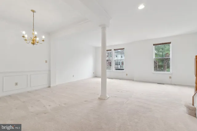 a view of empty room with windows